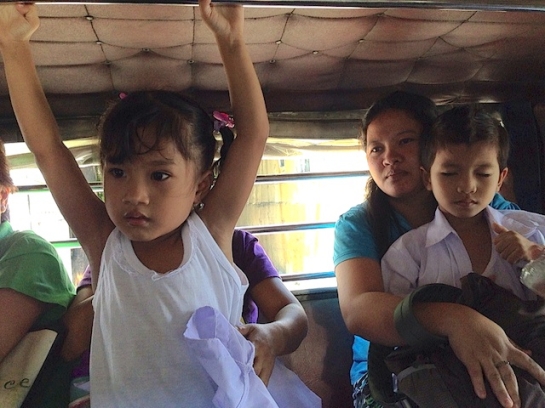 Children ride a jeep with their mothers in Pasig City, east of Manila, to enroll for school in June. - NJ Viehland Photos